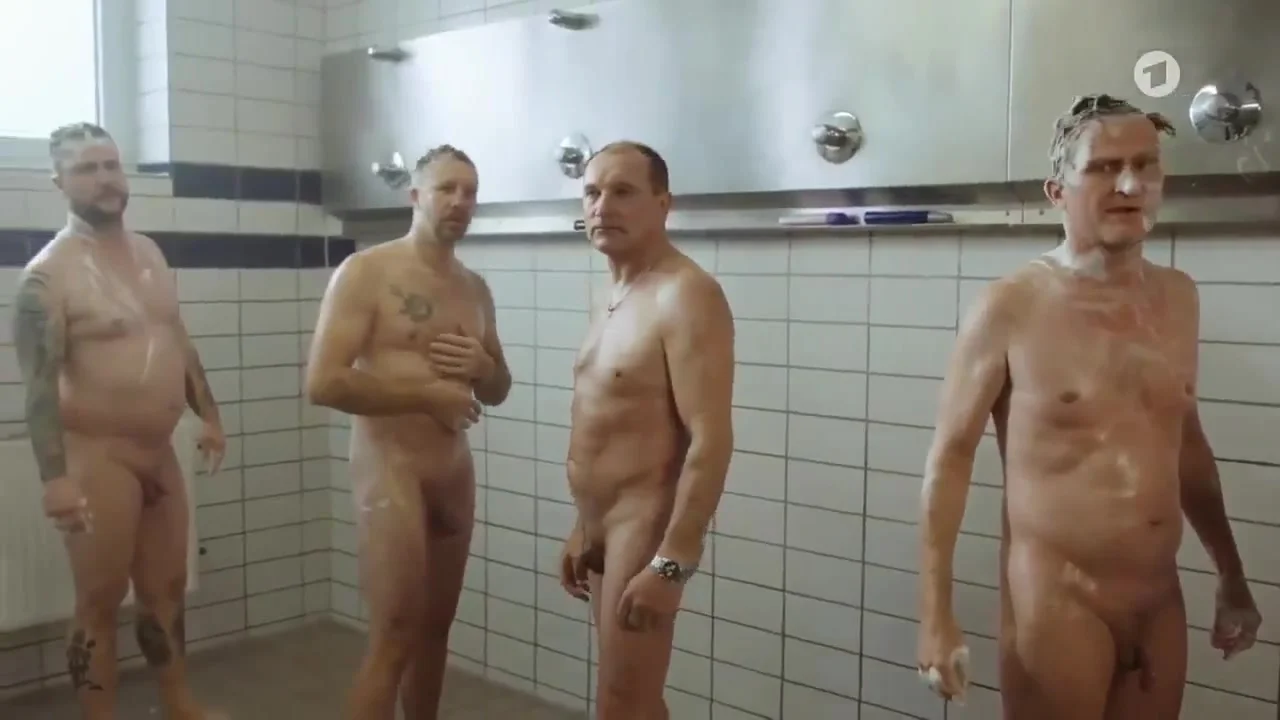 nude men showering together