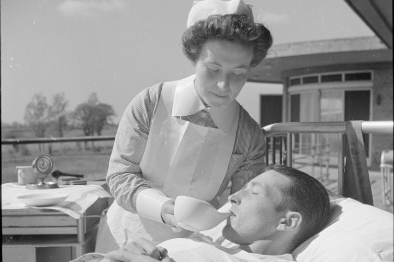 nurse giving enema